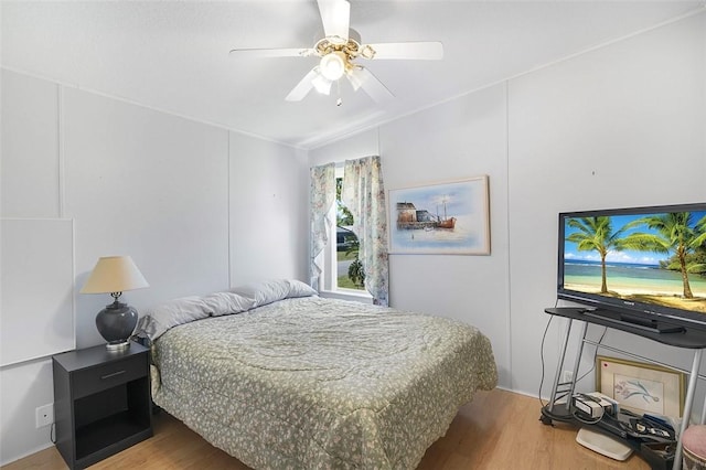 bedroom featuring ceiling fan and wood finished floors