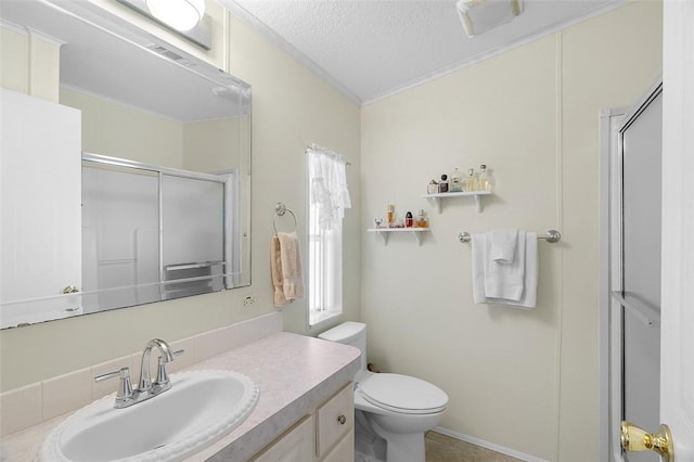 bathroom featuring a textured ceiling, a stall shower, toilet, and a healthy amount of sunlight