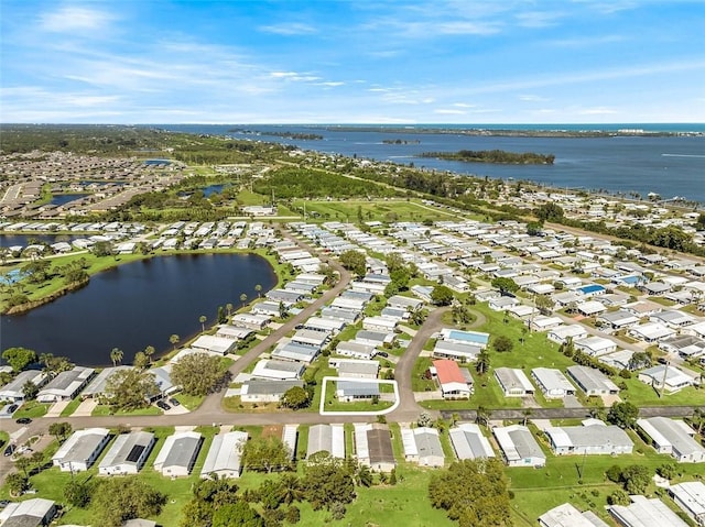 bird's eye view featuring a residential view and a water view