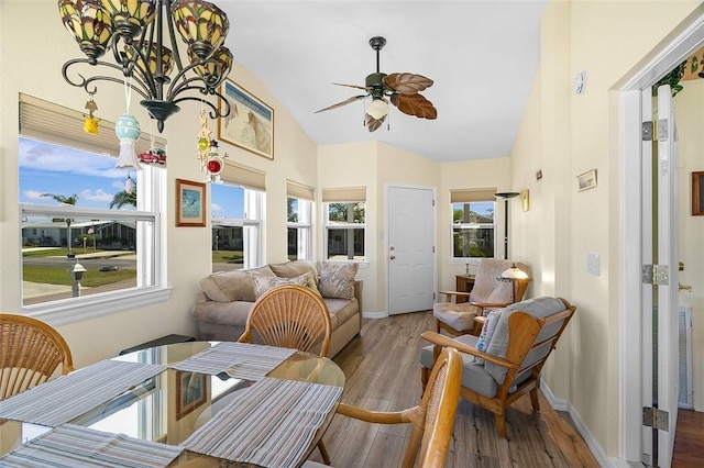 sunroom / solarium featuring lofted ceiling and ceiling fan