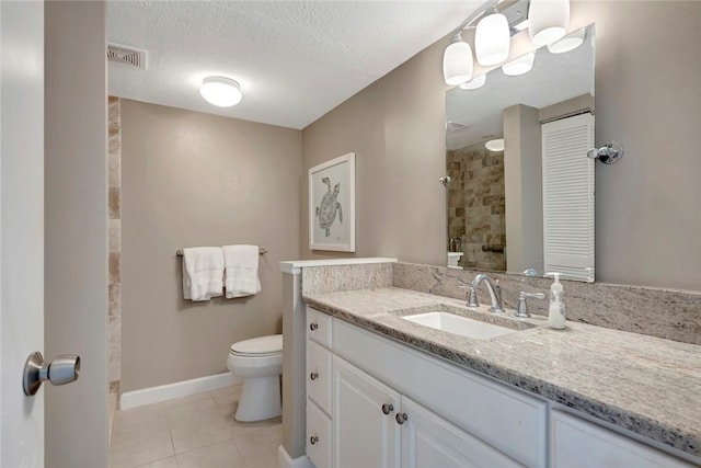 full bathroom with tile patterned flooring, toilet, visible vents, vanity, and tiled shower