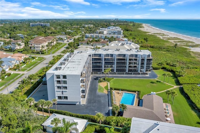 bird's eye view featuring a water view and a beach view