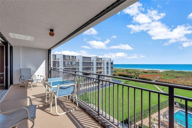 balcony featuring a water view