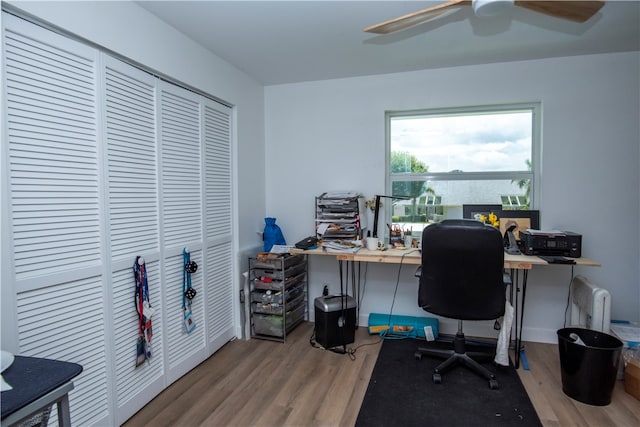 office space featuring hardwood / wood-style flooring and ceiling fan