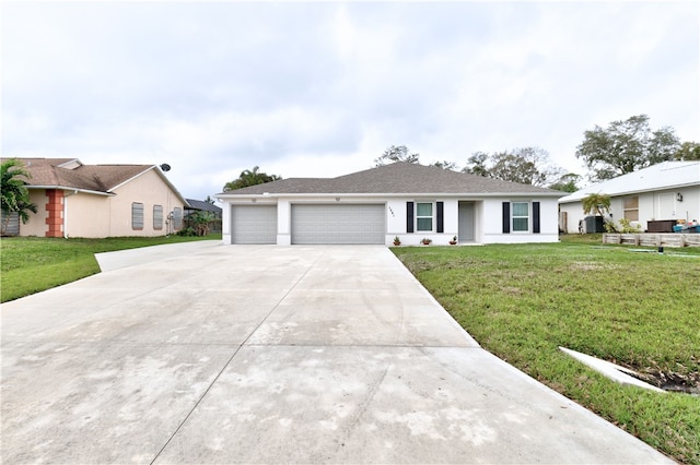 ranch-style home featuring a garage and a front yard