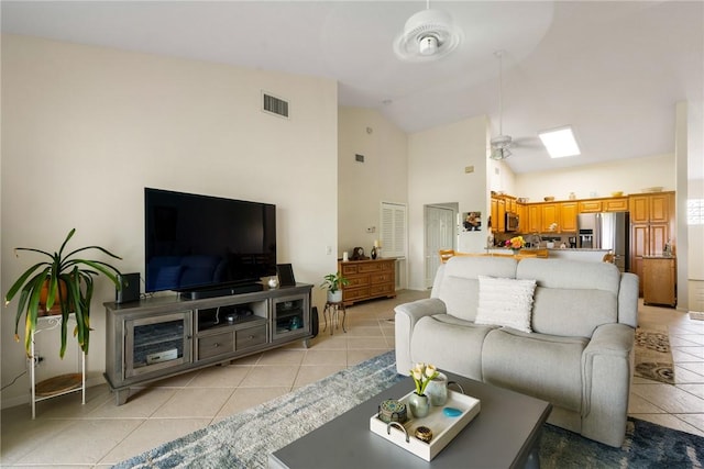 255 Grand Royale Cir Unit 204, Vero Beach, FL 32962 - living room with light tile patterned floors and high vaulted ceiling