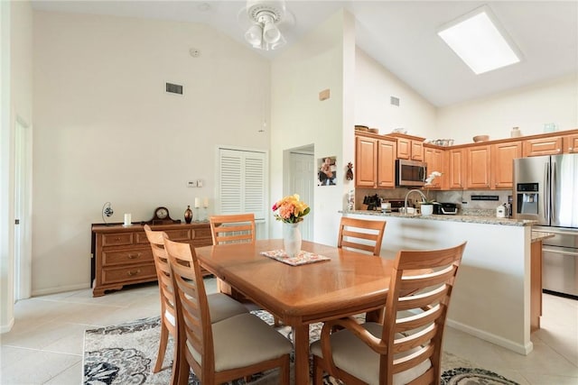 255 Grand Royale Cir Unit 204, Vero Beach, FL 32962 - dining room with high vaulted ceiling and light tile patterned floors