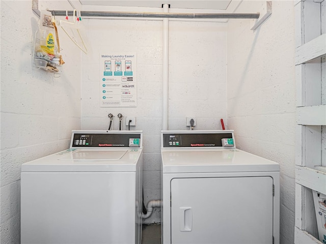 washroom with washer and dryer