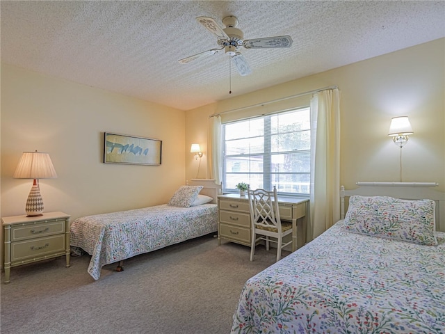 carpeted bedroom featuring a textured ceiling and ceiling fan