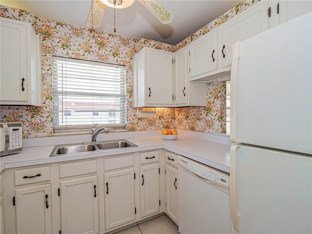 kitchen with white cabinetry, white appliances, sink, and ceiling fan