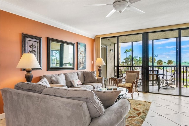 living room featuring ceiling fan, light tile patterned floors, and ornamental molding