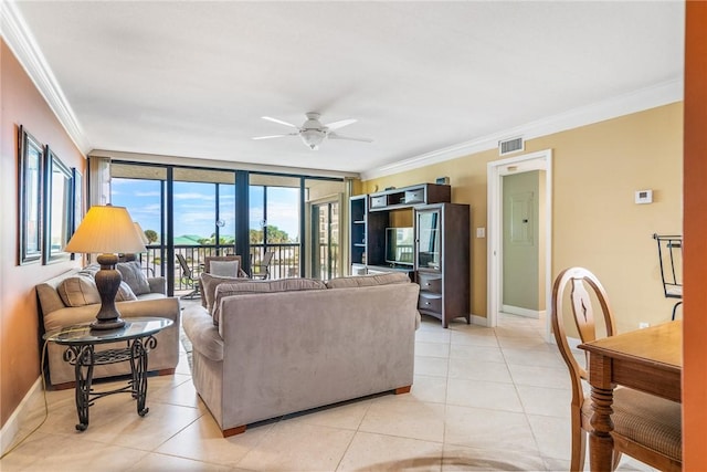 living room featuring light tile patterned floors, floor to ceiling windows, ornamental molding, and ceiling fan