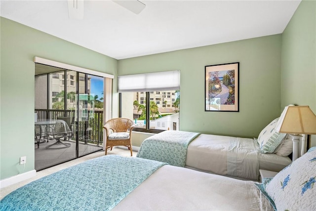 carpeted bedroom featuring access to outside and ceiling fan