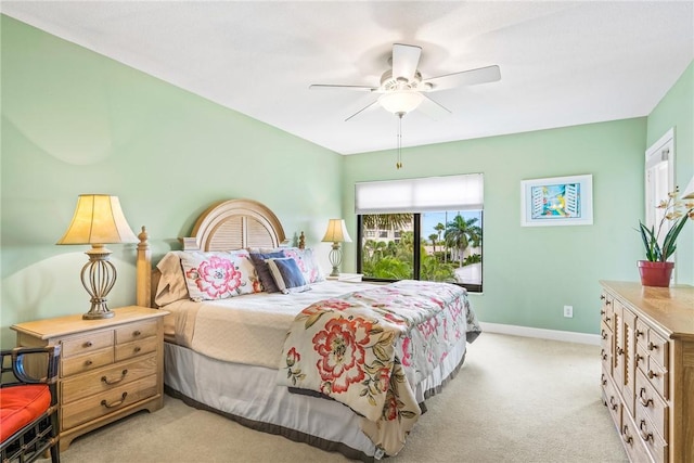 bedroom featuring ceiling fan and light colored carpet