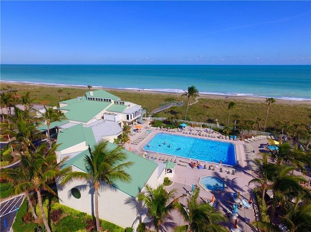 bird's eye view featuring a view of the beach and a water view