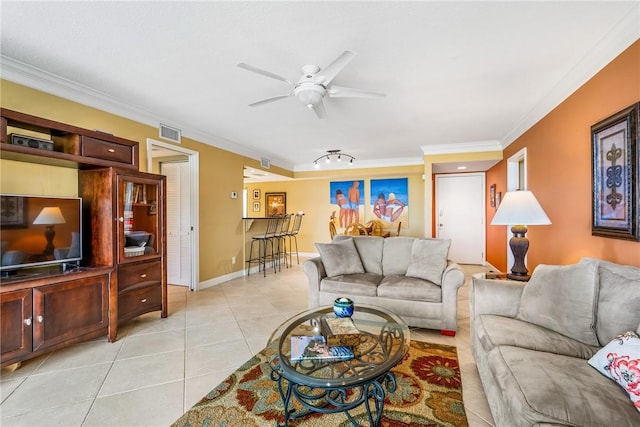 tiled living room featuring ceiling fan and crown molding