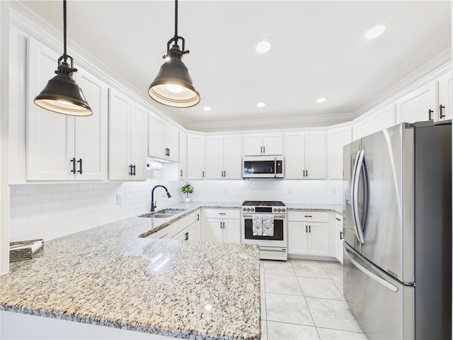 6104 Spicewood Ln, Vero Beach, FL 32966 - kitchen with white appliances, white cabinets, a peninsula, decorative backsplash, and ornamental molding