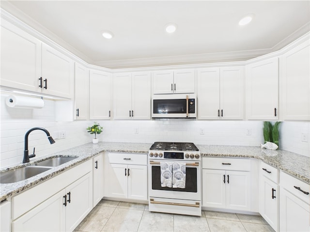 6104 Spicewood Ln, Vero Beach, FL 32966 - kitchen with white appliances, white cabinets, backsplash, light tile patterned floors, and recessed lighting