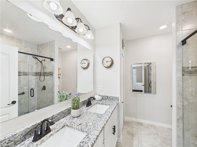 6104 Spicewood Ln, Vero Beach, FL 32966 - bathroom with a shower stall, double vanity, and tile patterned flooring