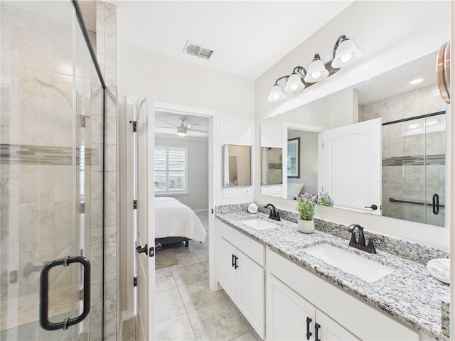 6104 Spicewood Ln, Vero Beach, FL 32966 - full bathroom with double vanity, a shower stall, ensuite bath, a ceiling fan, and tile patterned floors