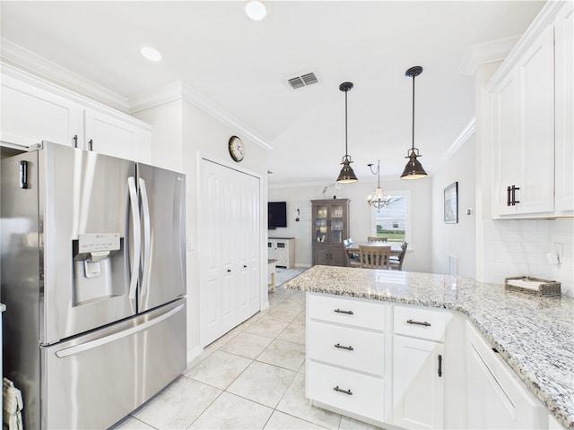 6104 Spicewood Ln, Vero Beach, FL 32966 - kitchen featuring stainless steel fridge, ornamental molding, a peninsula, white cabinets, and light tile patterned flooring