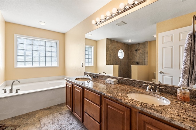 full bathroom with independent shower and bath, vanity, and toilet