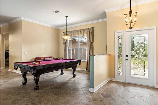 recreation room with washer / dryer, plenty of natural light, and ornamental molding