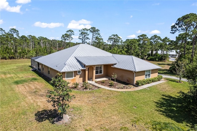 view of front of property with a front lawn