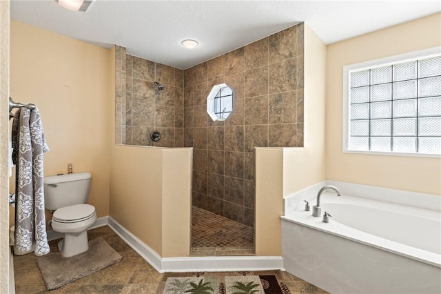 bathroom featuring shower with separate bathtub and toilet