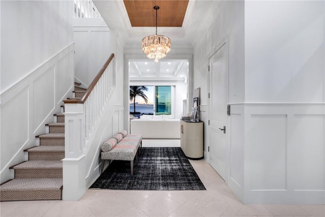 entryway with a chandelier