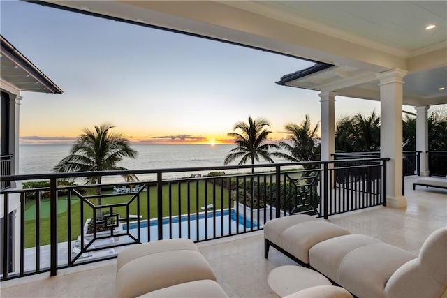 balcony at dusk with a water view