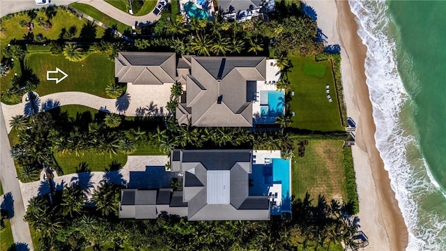 aerial view featuring a water view and a view of the beach