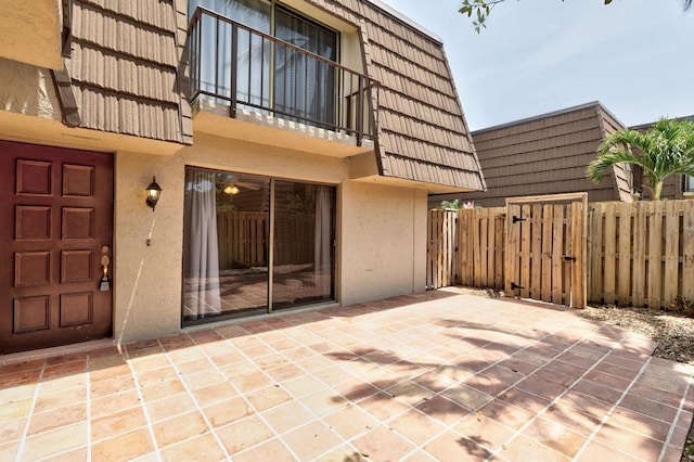 1166 6th Ave Unit 19C, Vero Beach, FL 32960 - view of patio featuring a balcony and a gate