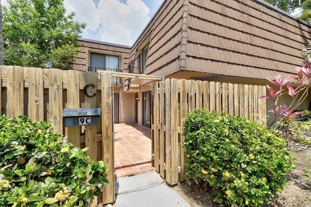 1166 6th Ave Unit 19C, Vero Beach, FL 32960 - doorway to property featuring mansard roof