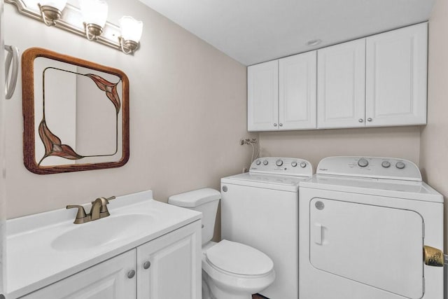 1166 6th Ave Unit 19C, Vero Beach, FL 32960 - half bathroom with washing machine and clothes dryer, toilet, and vanity