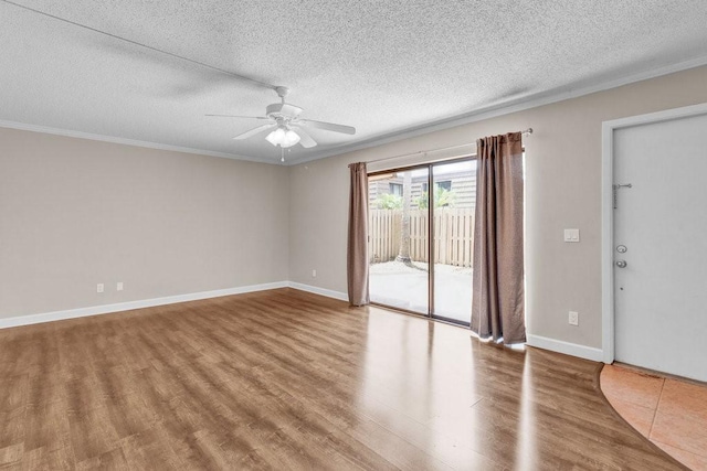 1166 6th Ave Unit 19C, Vero Beach, FL 32960 - empty room featuring crown molding, wood finished floors, ceiling fan, a textured ceiling, and baseboards