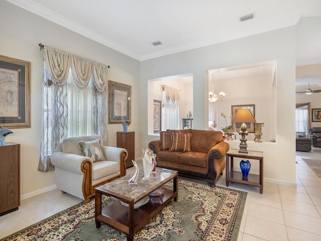 9535 E Maiden Ct, Vero Beach, FL 32963 - living room with light tile patterned floors, ornamental molding, a chandelier, and ceiling fan