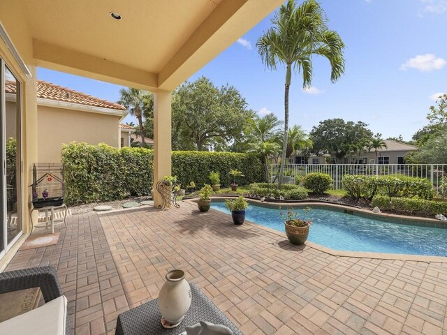 9535 E Maiden Ct, Vero Beach, FL 32963 - view of swimming pool with a fenced backyard and a patio
