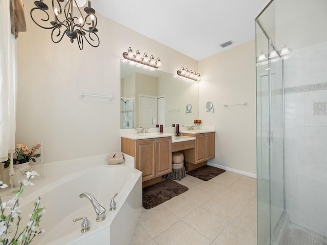 9535 E Maiden Ct, Vero Beach, FL 32963 - bathroom with vanity, a bath, a stall shower, tile patterned flooring, and a chandelier