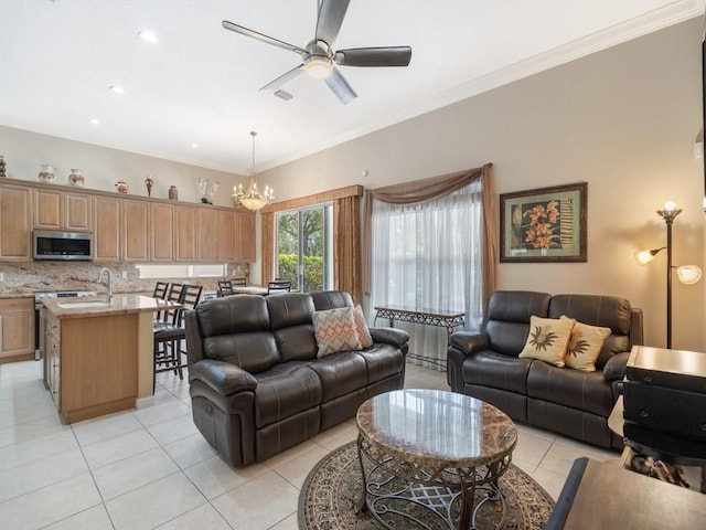 9535 E Maiden Ct, Vero Beach, FL 32963 - living area with light tile patterned floors, ceiling fan, ornamental molding, and a chandelier