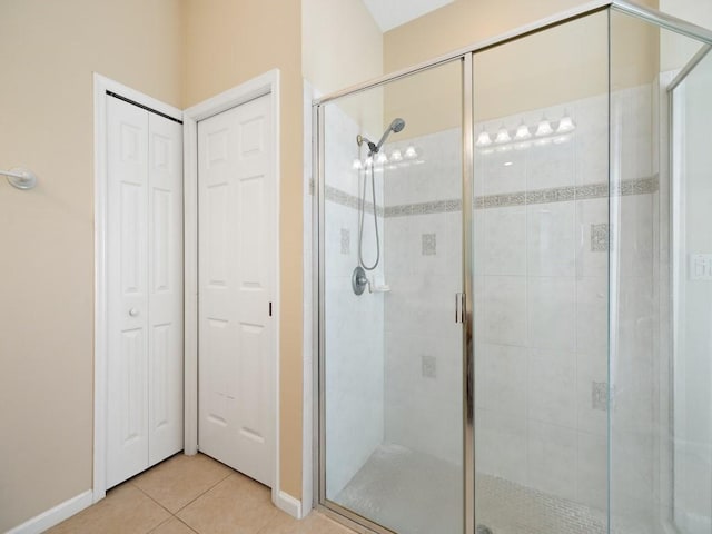 9535 E Maiden Ct, Vero Beach, FL 32963 - full bathroom featuring tile patterned flooring, a shower stall, and a closet