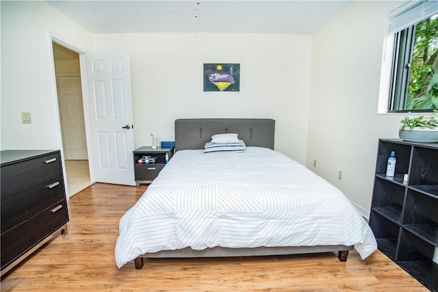 bedroom with light hardwood / wood-style flooring