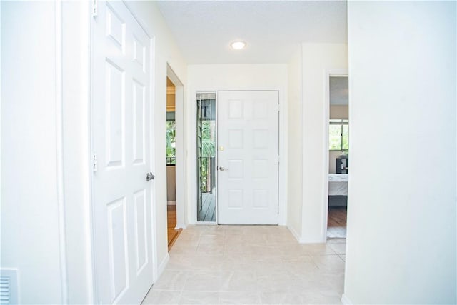 foyer with light tile patterned floors