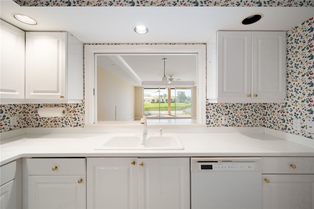 kitchen featuring white cabinets, dishwasher, sink, and tasteful backsplash