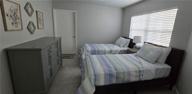 bedroom with light tile patterned floors