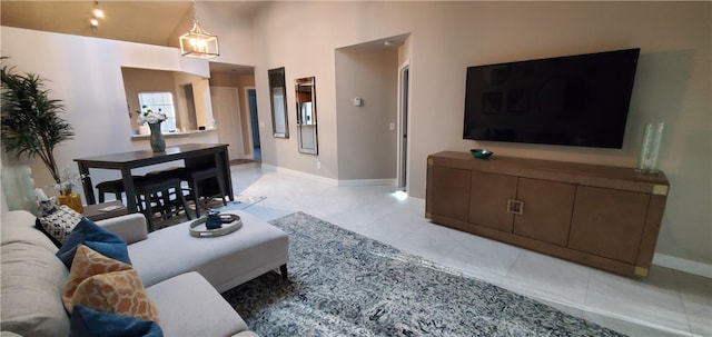 tiled living room with high vaulted ceiling