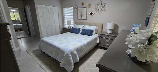 tiled bedroom featuring a closet