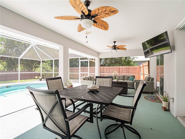 view of patio with a fenced in pool, outdoor lounge area, a lanai, and ceiling fan