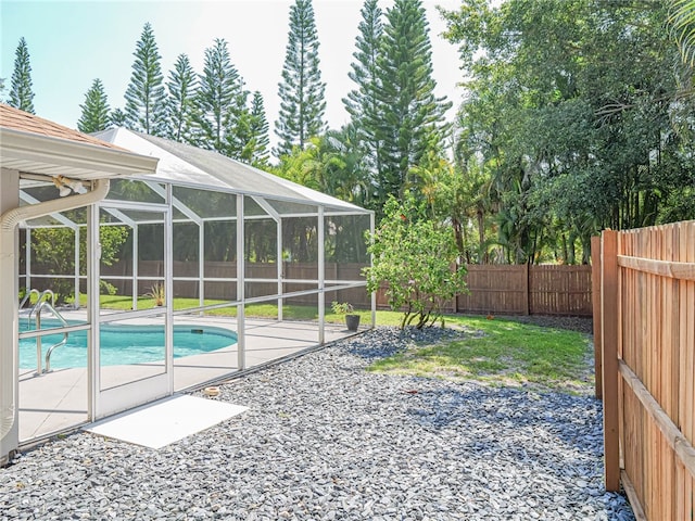 view of pool with a lanai and a patio area