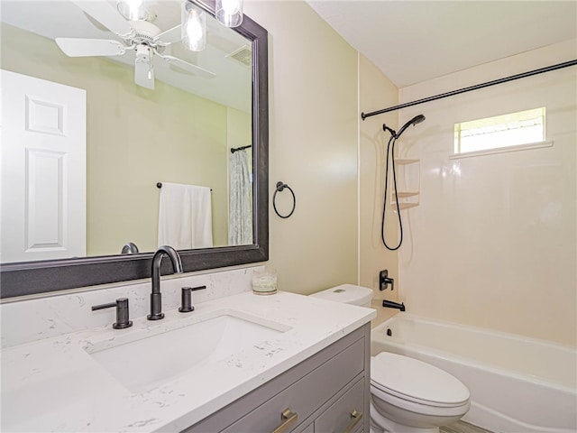 full bathroom featuring vanity, shower / bath combination with curtain, and toilet